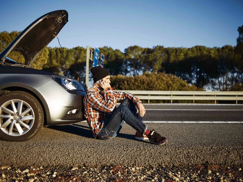 man-talking-phone-car-min.jpg
