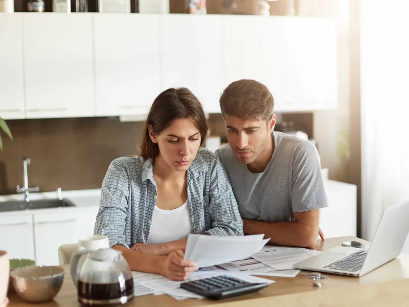young-couple-checking-their-family-budget-min.jpg