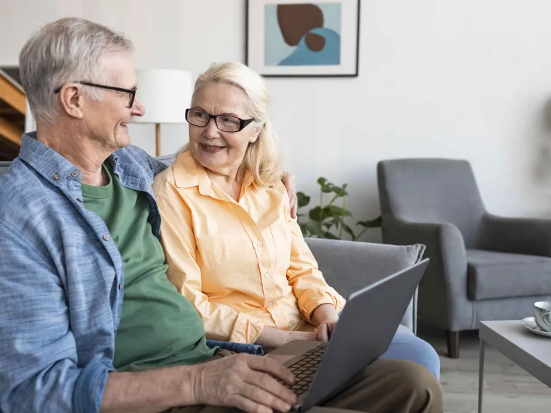 medium-shot-senior-couple-with-laptop-min.jpg