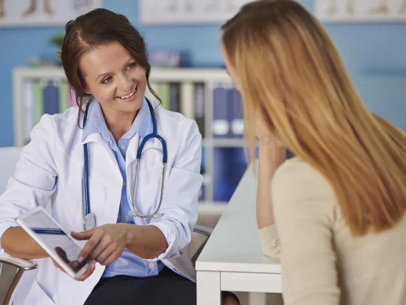 young-woman-paying-visit-doctor-min.jpg