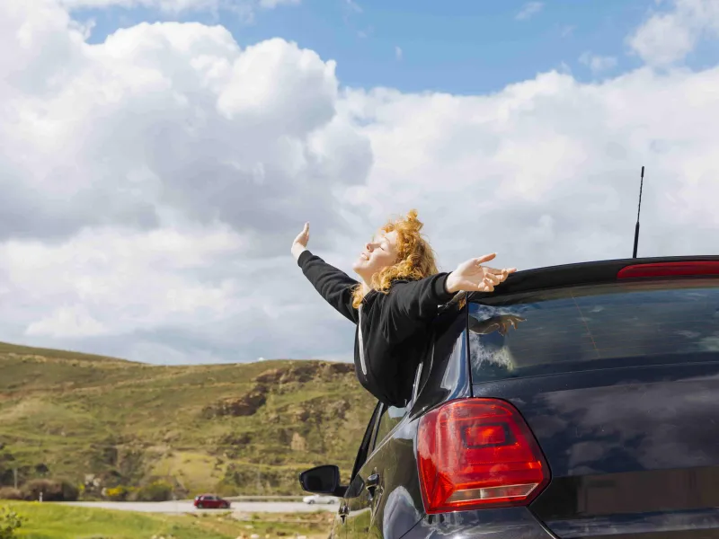young-smiling-female-enjoying-trip-(1)-min.jpg