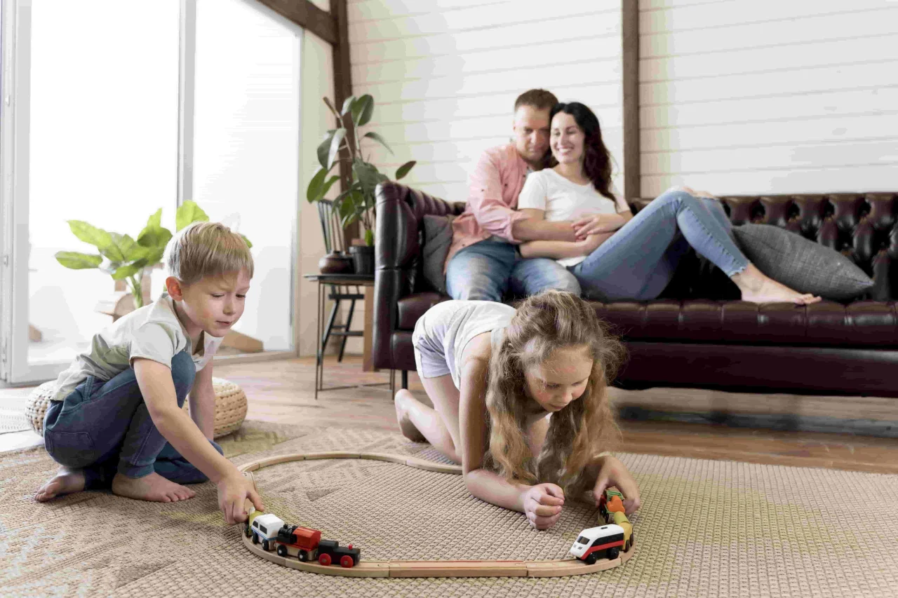 full-shot-parents-watching-children-play-(1)-min-(1)