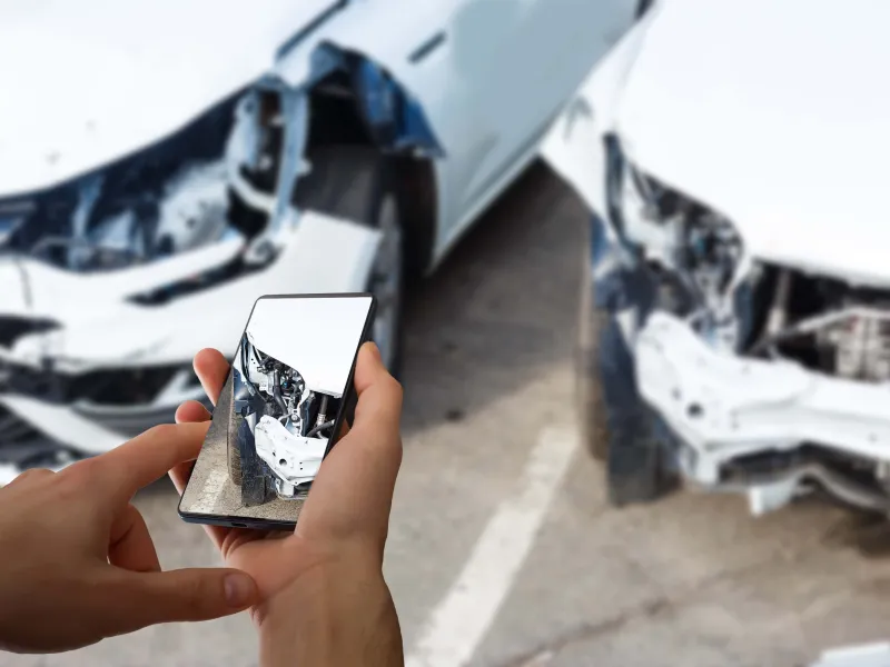 man-photographing-his-vehicle-with-damages-accident-insurance-with-smart-phone-(c).jpg