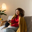medium-shot-woman-holding-remote-min-(c)